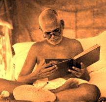 Ramana Maharshi reading a book